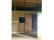 Picture of an unfinished basement with concrete walls and a wood framed doorway at 985 Romer Pl, Stone Mountain, GA 30083