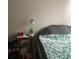 Relaxing bedroom setting with a comfortable bed and a side table at 985 Romer Pl, Stone Mountain, GA 30083