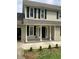 Charming two-story home with a welcoming front porch and classic black shutters at 985 Romer Pl, Stone Mountain, GA 30083