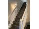 Staircase with hardwood steps and white railing at 985 Romer Pl, Stone Mountain, GA 30083