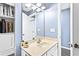 Bathroom with a single sink, mirror and white cabinets at 1114 Ivey Chase Pl, Dacula, GA 30019