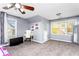 Spacious bedroom featuring two windows, TV, and desk for work from home at 1114 Ivey Chase Pl, Dacula, GA 30019