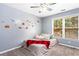 Cozy bedroom with ample natural light and playful car themed décor at 1114 Ivey Chase Pl, Dacula, GA 30019