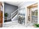 Elegant entryway with marble floors, gray walls, staircase, and a mirrored console table at 1114 Ivey Chase Pl, Dacula, GA 30019