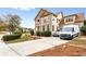 Lovely two-story home with brick and siding, landscaped front yard and long paved driveway at 1114 Ivey Chase Pl, Dacula, GA 30019