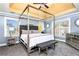 Comfortable main bedroom suite featuring a decorative trey ceiling and multiple windows at 1114 Ivey Chase Pl, Dacula, GA 30019