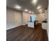 New eat-in kitchen features a black island, stainless appliances, and hardwood floors at 128 Bert Lane Se # 167, Atlanta, GA 30316