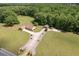 Scenic aerial view of a home nestled in a lush wooded area with beautiful landscaping elements at 1724 Arbor Hill Rd, Canton, GA 30115