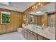 Bathroom featuring wood paneled walls, white tile flooring, and an extended vanity at 1724 Arbor Hill Rd, Canton, GA 30115