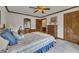 Spacious bedroom featuring classic furniture, wall art, and a ceiling fan at 1724 Arbor Hill Rd, Canton, GA 30115