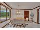 Cozy dining room featuring a wooden table, seating for four, and a large window overlooking the yard at 1724 Arbor Hill Rd, Canton, GA 30115