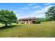 View of the home's back exterior featuring the outdoor deck and lower-level access at 1724 Arbor Hill Rd, Canton, GA 30115