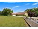 Well-maintained home with a large, green yard, a circular driveway, and meticulous landscaping along the foundation at 1724 Arbor Hill Rd, Canton, GA 30115