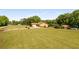 Wide shot of home with long driveway, two-car garage, outbuilding, and surrounding landscaping and trees at 1724 Arbor Hill Rd, Canton, GA 30115