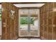 View through open double front doors showcasing a sunlit driveway and the home's well-maintained exterior at 1724 Arbor Hill Rd, Canton, GA 30115