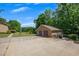 Two car detached garage with a long driveway and mature trees in a beautiful yard at 1724 Arbor Hill Rd, Canton, GA 30115