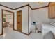 Bright laundry area with white appliances, tiled flooring, and storage solutions at 1724 Arbor Hill Rd, Canton, GA 30115