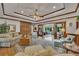 Spacious living room featuring hardwood floors, coffered ceilings, custom built-ins, and plenty of seating arrangements at 1724 Arbor Hill Rd, Canton, GA 30115