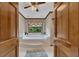Elegant main bathroom featuring a large garden tub with swan accents and garden view at 1724 Arbor Hill Rd, Canton, GA 30115