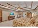 Comfortable primary bedroom with decorative tray ceiling, ceiling fan, and natural light at 1724 Arbor Hill Rd, Canton, GA 30115