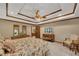 Main bedroom features a tray ceiling, ceiling fan, and an ensuite bathroom at 1724 Arbor Hill Rd, Canton, GA 30115