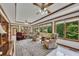 Bright sun room with multiple armchairs and a view of the well-maintained lawn at 1724 Arbor Hill Rd, Canton, GA 30115