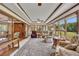 Bright sun room with multiple armchairs and a view of the well-maintained lawn at 1724 Arbor Hill Rd, Canton, GA 30115