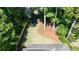 Backyard view of a home with an enclosed fence, trees and a blue trampoline at 23 Long Island Pl, Sandy Springs, GA 30328