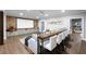 Spacious basement with home theater, brick wall, custom cabinets and bar seating at 23 Long Island Pl, Sandy Springs, GA 30328