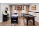 Finished basement with brick wall, kitchenette area, and arcade games at 23 Long Island Pl, Sandy Springs, GA 30328