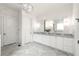 Bright bathroom featuring dual vanity, gray marble countertops, and modern lighting fixtures at 23 Long Island Pl, Sandy Springs, GA 30328