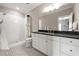 Bathroom with a tiled walk in shower, white cabinets, and large vanity mirror at 23 Long Island Pl, Sandy Springs, GA 30328