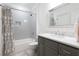 Elegant bathroom with gray subway tiles, marble countertop, and a shower-tub combination at 23 Long Island Pl, Sandy Springs, GA 30328