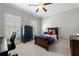 Cozy bedroom featuring neutral walls, a ceiling fan, window shutters, and dark wood furniture at 23 Long Island Pl, Sandy Springs, GA 30328