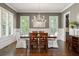 Formal dining room with sophisticated decor, plantation shutters, and hardwood floors for elegant gatherings at 23 Long Island Pl, Sandy Springs, GA 30328