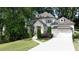 Beautiful two-story home with lush greenery, a two-car garage, and manicured landscaping for a serene setting at 23 Long Island Pl, Sandy Springs, GA 30328