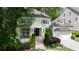 Charming two-story traditional home with a welcoming porch, stone stairs and manicured landscaping at 23 Long Island Pl, Sandy Springs, GA 30328