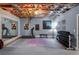 Basement gym with exposed ceiling featuring workout equipment, mirrors, and inspirational wall art at 23 Long Island Pl, Sandy Springs, GA 30328
