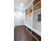 Well-organized mudroom with built-in cubbies, shelving, and dark hardwood flooring at 23 Long Island Pl, Sandy Springs, GA 30328