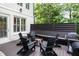 Outdoor seating area with a fire pit, grill, and built-in benches, perfect for gatherings and BBQs at 23 Long Island Pl, Sandy Springs, GA 30328