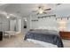 Spacious bedroom with two ceiling fans, carpet, and a king sized bed at 2297 Ironwood Hill Ct, Dacula, GA 30019