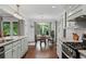 Dining area filled with natural light from the large windows with backyard views at 2297 Ironwood Hill Ct, Dacula, GA 30019