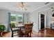 Bright and airy dining room with a view of the front yard through a large window at 2297 Ironwood Hill Ct, Dacula, GA 30019