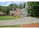 This traditional brick home includes an attached two-car garage and inviting landscaping at 2297 Ironwood Hill Ct, Dacula, GA 30019