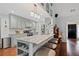 Bright kitchen with marble countertops, island seating, and stainless steel appliances at 2297 Ironwood Hill Ct, Dacula, GA 30019