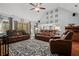 Open living room with vaulted ceilings, hardwood floors, and a cozy seating arrangement at 2297 Ironwood Hill Ct, Dacula, GA 30019