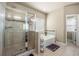 Bathroom featuring glass enclosed shower and separate soaking tub with tiled accents at 3755 Lake Haven Way, Atlanta, GA 30349