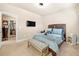 Bright bedroom offers a walk-in closet and calming color palette at 3755 Lake Haven Way, Atlanta, GA 30349