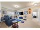 Bonus room featuring comfortable seating, large television, and carpet flooring at 3755 Lake Haven Way, Atlanta, GA 30349