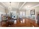 Bright dining room with hardwood floors, chandelier, and wainscoting, perfect for entertaining at 3755 Lake Haven Way, Atlanta, GA 30349